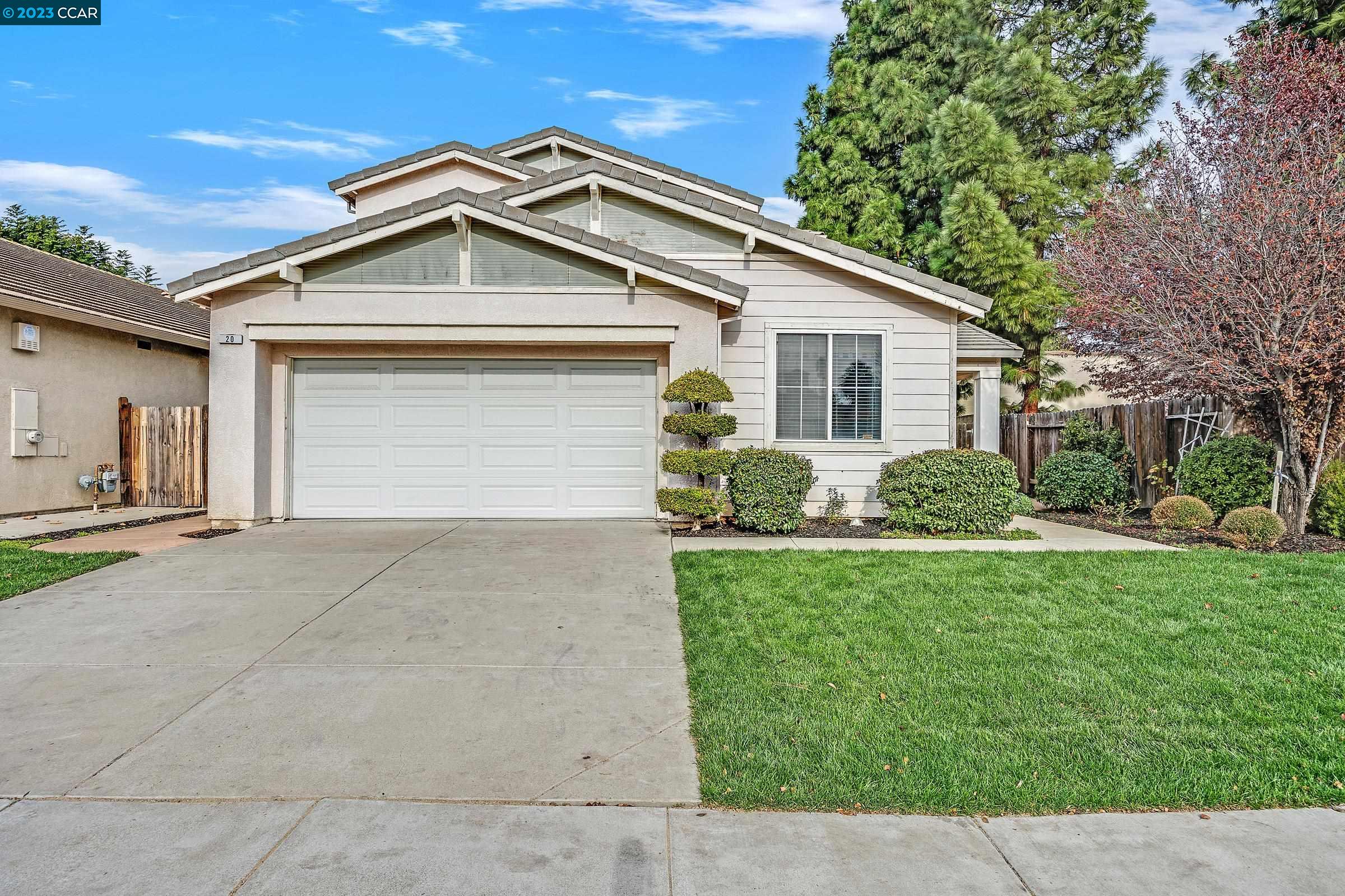 a front view of house with yard