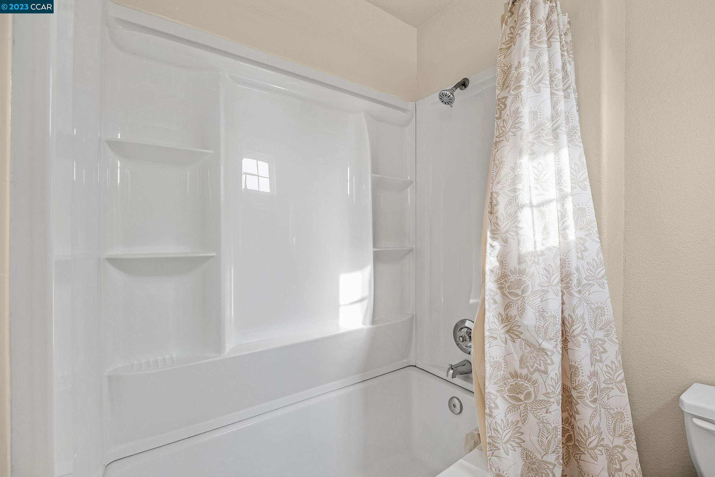 20 West 6th Street Pittsburg, CA 94565 - Photo 13 of 15 a bathroom with a bathtub and shower