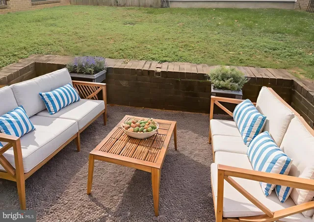 a terrace of a house with outdoor seating