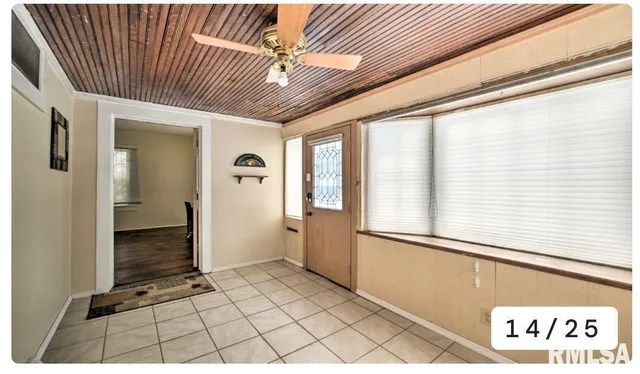 a view of a dining room with furniture and a window