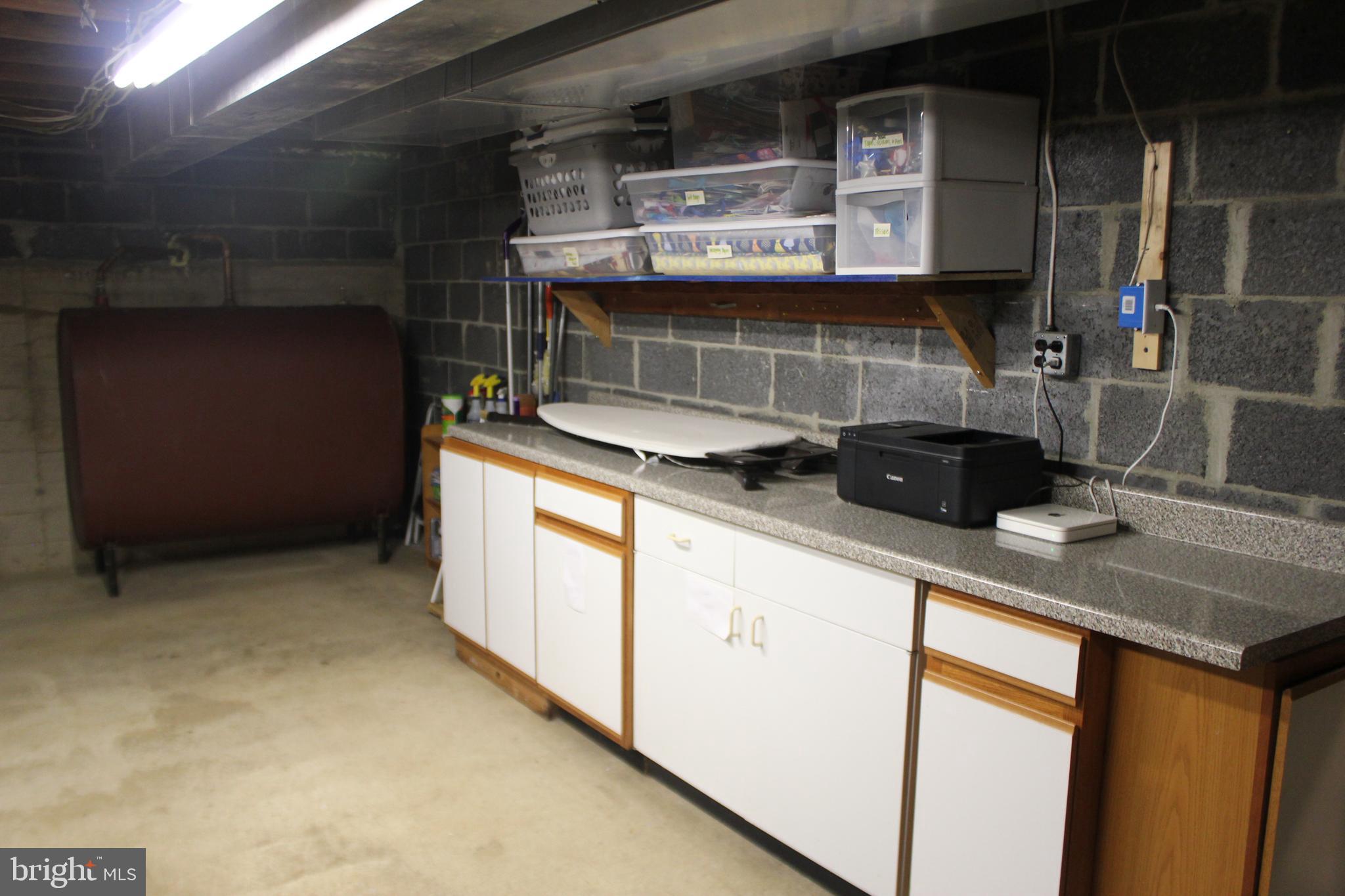 331 St James Road West Chester, PA 19380 - Photo 32 of 43 Basement Laundry Area - Cabinets & Counter to stay