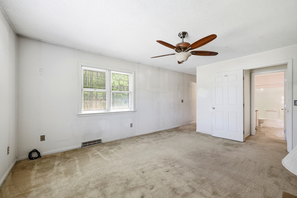 19-21 Wedgewood Circle Springfield, MA 01129 - Photo 19 of 32 a view of a livingroom with a window and a ceiling fan