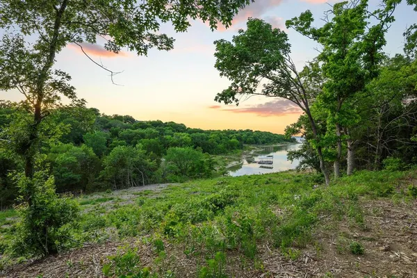 a view of lake with green space