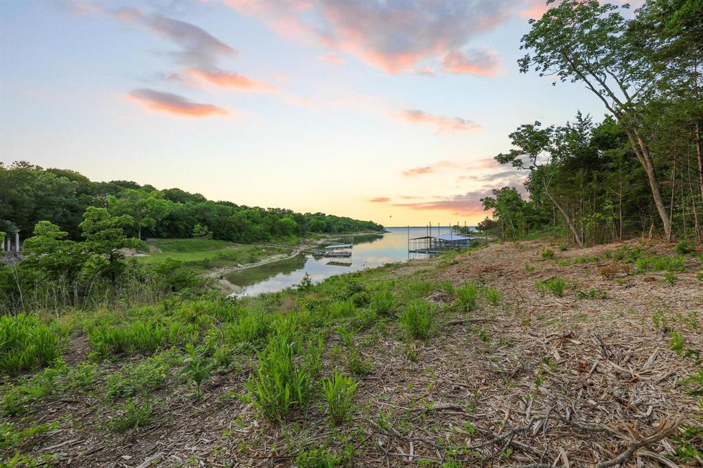 437 Neva Lane Denison, TX 75020 - Photo 14 of 40 a view of a lake view with mountain in the back