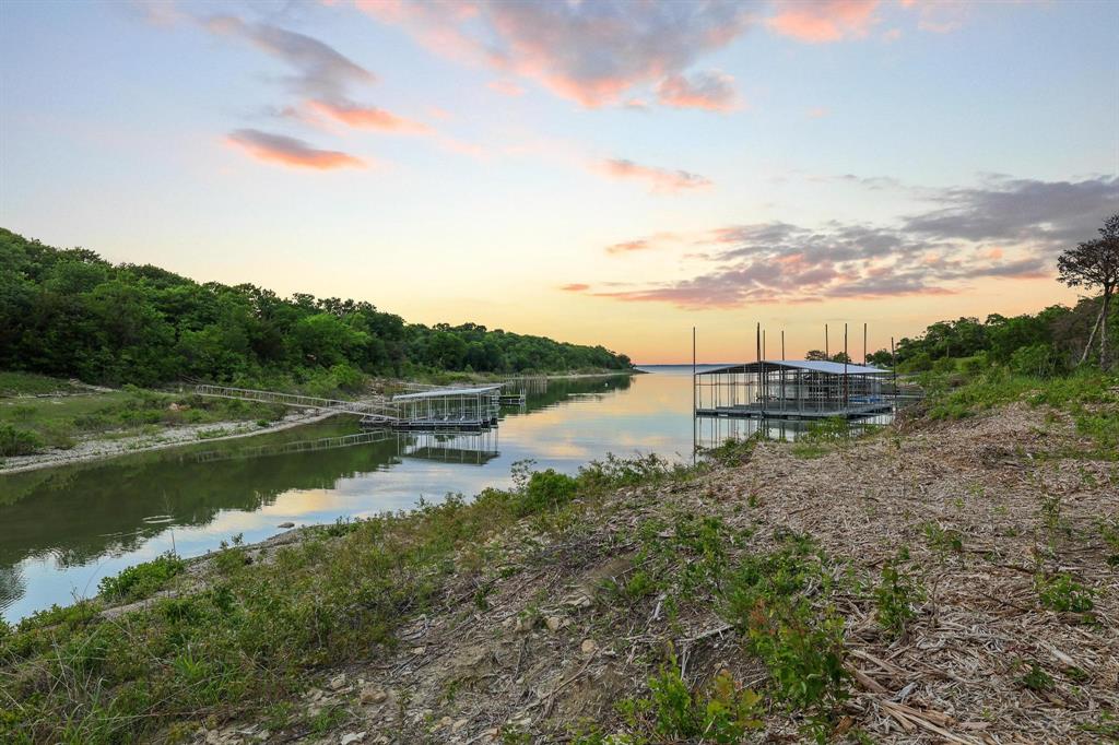 437 Neva Lane Denison, TX 75020 - Photo 16 of 40 a view of lake with green space