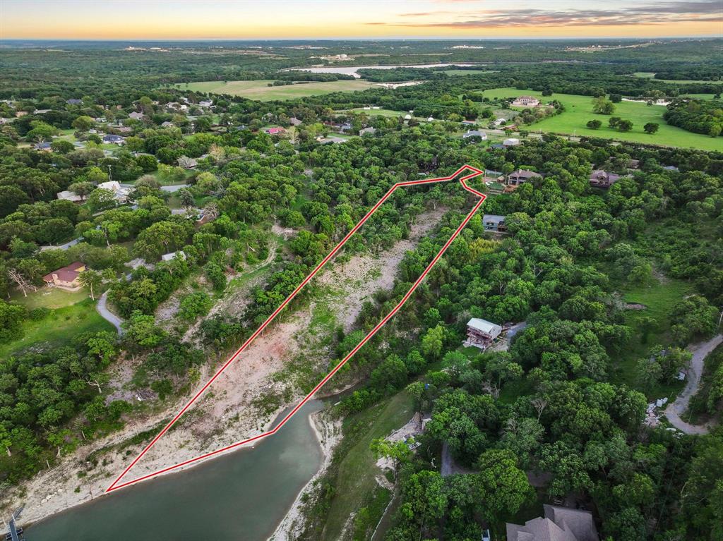 437 Neva Lane Denison, TX 75020 - Photo 3 of 40 a view of a city with lush green forest