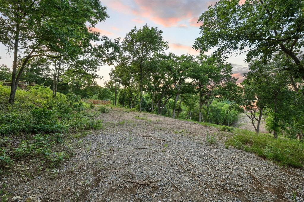 437 Neva Lane Denison, TX 75020 - Photo 10 of 40 a view of a forest with trees in the background