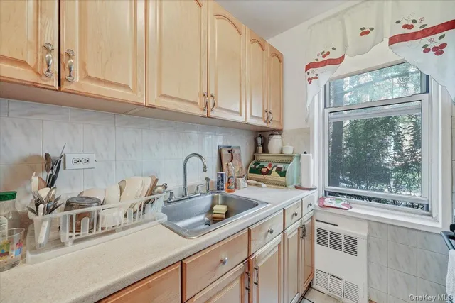 a kitchen with stainless steel appliances granite countertop a sink and cabinets