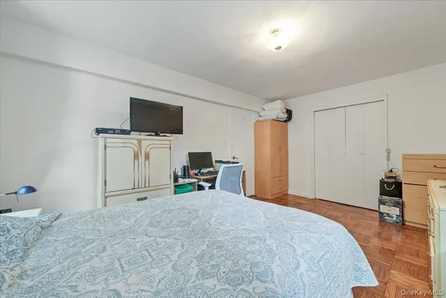 a view of a livingroom with furniture and a flat screen tv