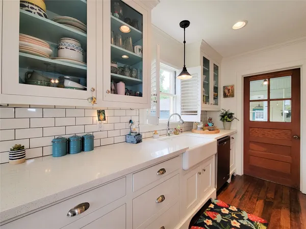 a bathroom with a double vanity sink a mirror and a shower