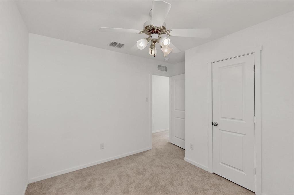 918 Grebe Drive Princeton, TX 75407 - Photo 12 of 29 wooden floor in an empty room