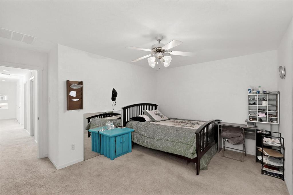 918 Grebe Drive Princeton, TX 75407 - Photo 14 of 29 a living room with furniture and a chandelier