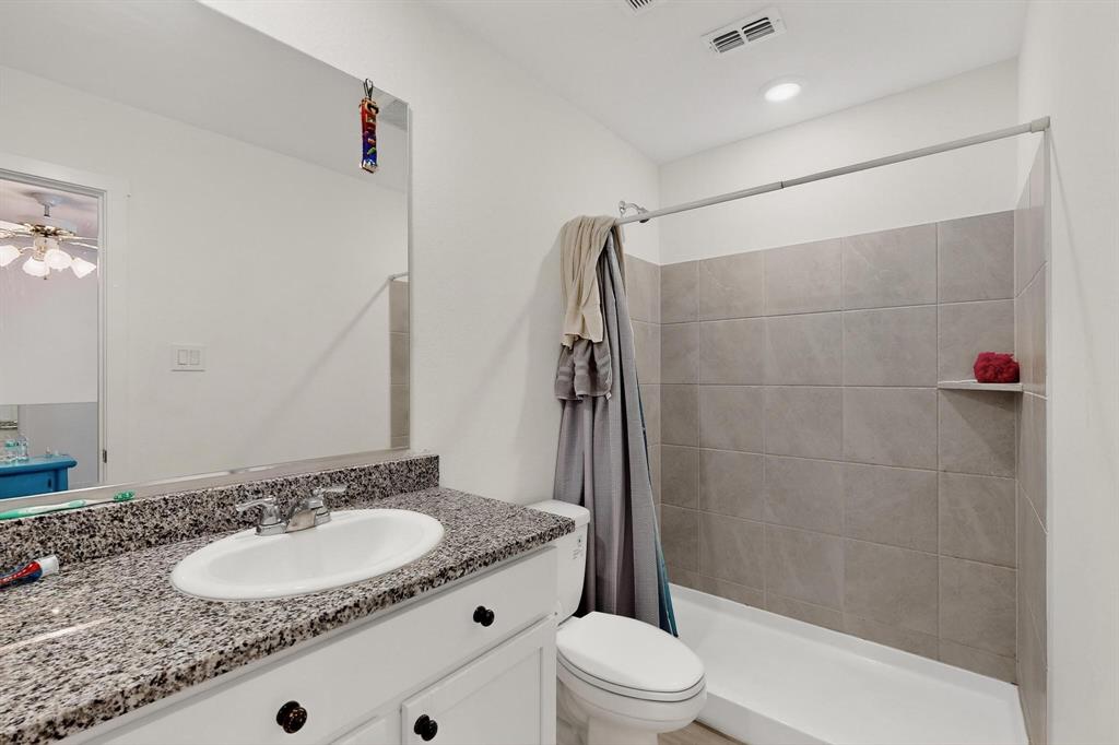 918 Grebe Drive Princeton, TX 75407 - Photo 15 of 29 a bathroom with a sink toilet and shower