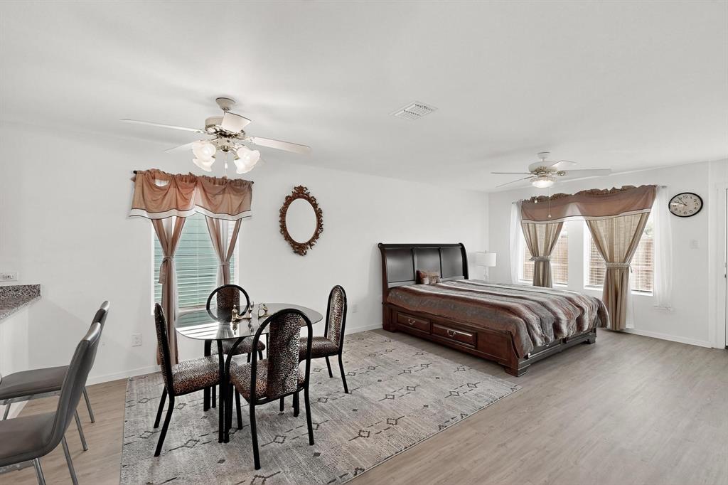 918 Grebe Drive Princeton, TX 75407 - Photo 21 of 29 a bedroom with furniture and a chair