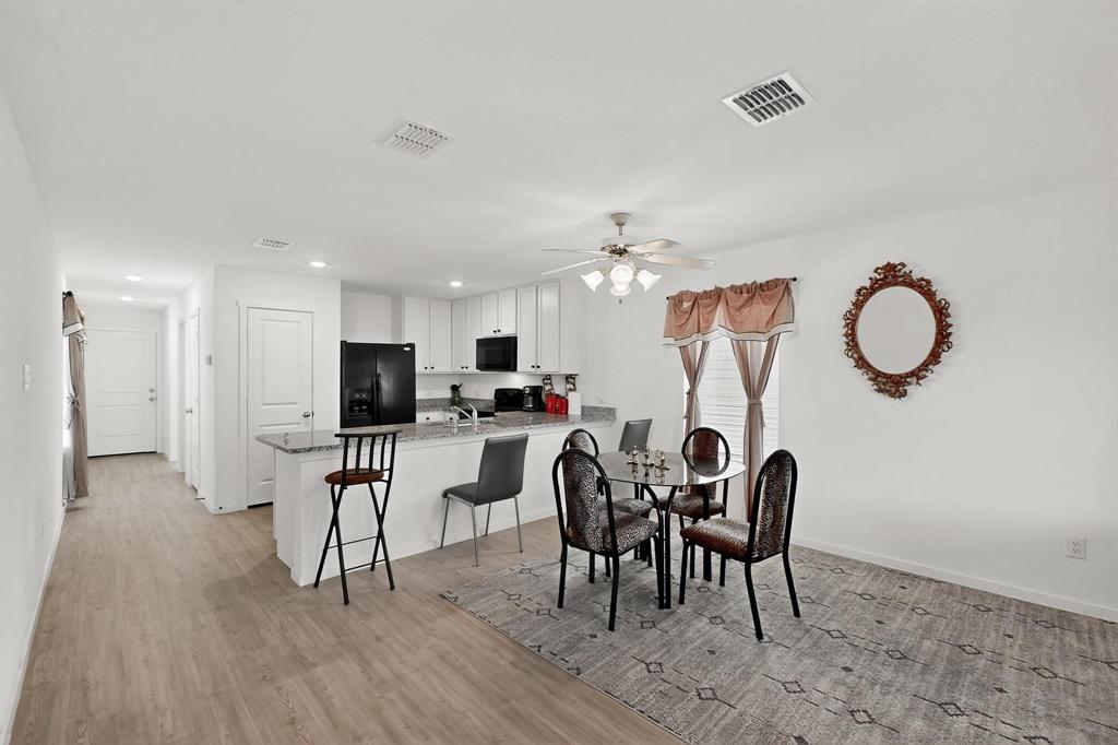 918 Grebe Drive Princeton, TX 75407 - Photo 22 of 29 a view of a dining room with furniture and chandelier