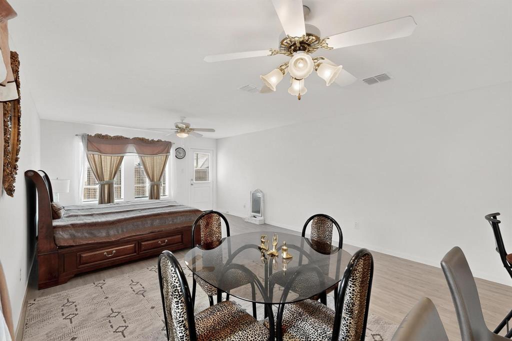 918 Grebe Drive Princeton, TX 75407 - Photo 27 of 29 a view of a dining room with furniture and chandelier