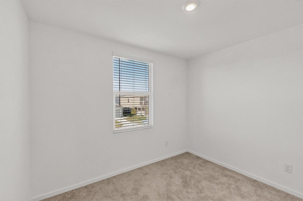 918 Grebe Drive Princeton, TX 75407 - Photo 6 of 29 an empty room with windows