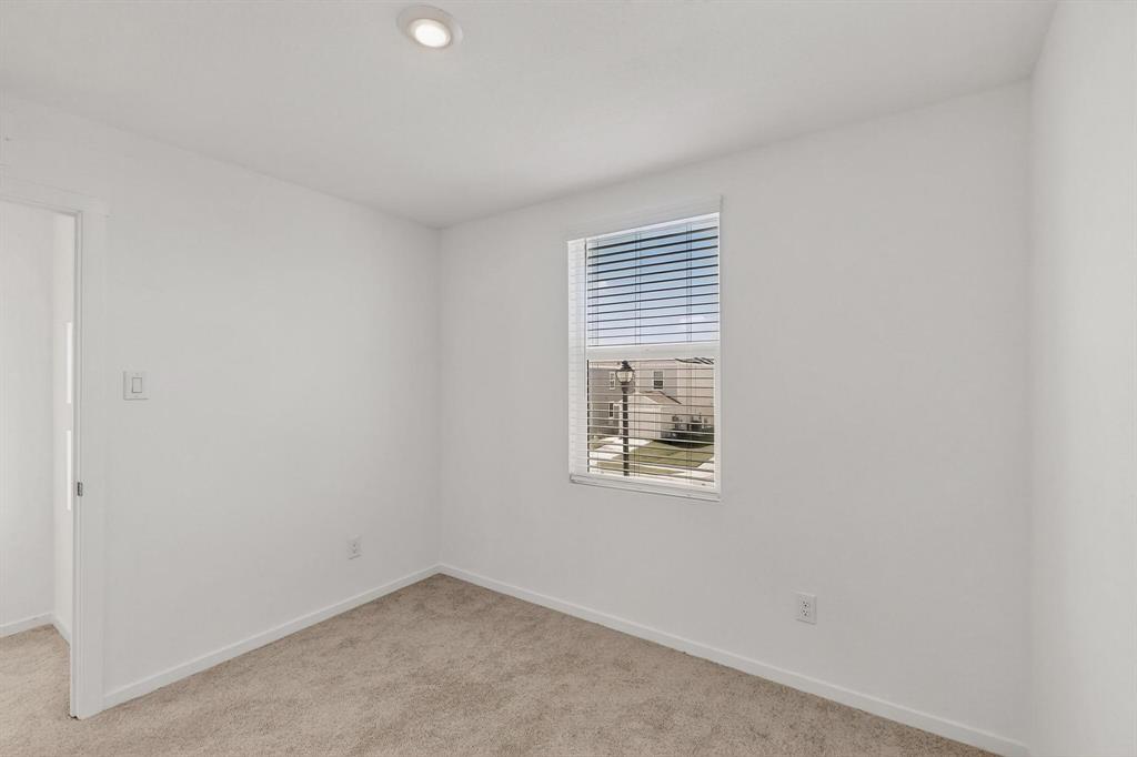 918 Grebe Drive Princeton, TX 75407 - Photo 8 of 29 an empty room with windows