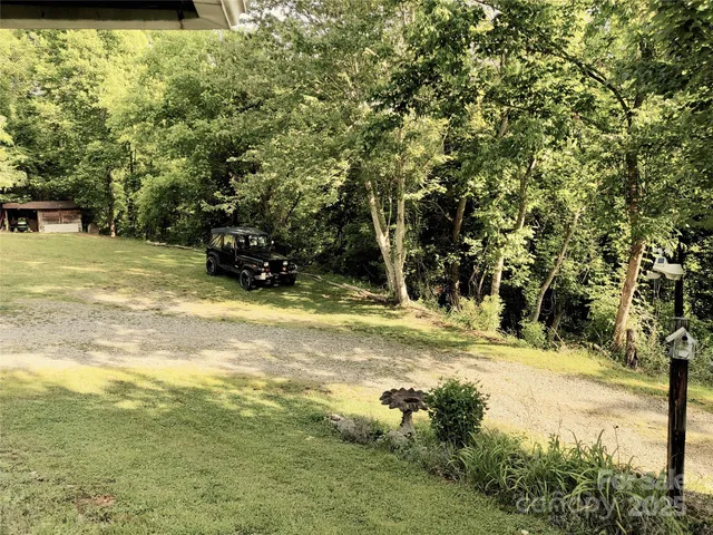 a view of a yard with swimming pool