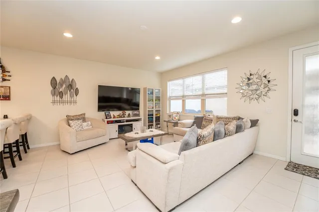 a living room with furniture and a large window