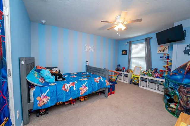 a bathroom with a granite countertop sink a toilet and a mirror
