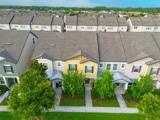 an aerial view of a house with outdoor space