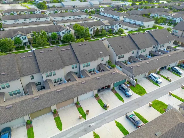 an aerial view of a house with a garden