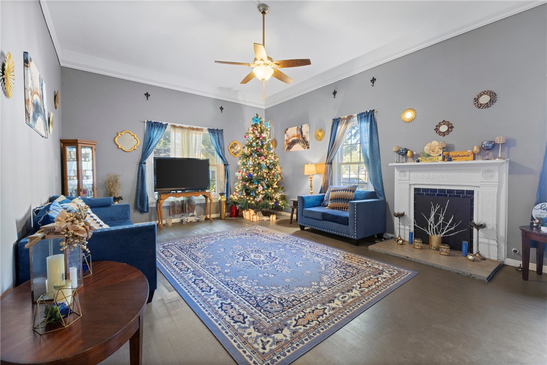 1007 South Magnolia Street Hearne, TX 77859 - Photo 1 of 25 a living room with furniture and a fireplace