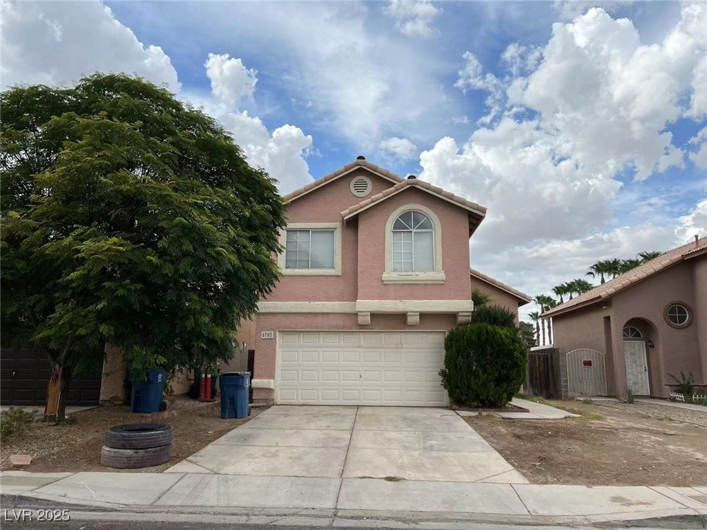 View of front of property with an attached garage,