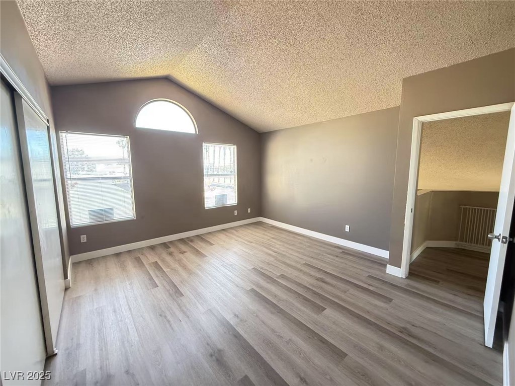 Undisclosed Address Las Vegas, NV 89142 - Photo 12 of 14 Unfurnished bedroom with a closet, vaulted ceiling