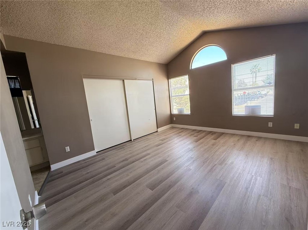 Undisclosed Address Las Vegas, NV 89142 - Photo 13 of 14 Unfurnished bedroom with a textured ceiling, wood
