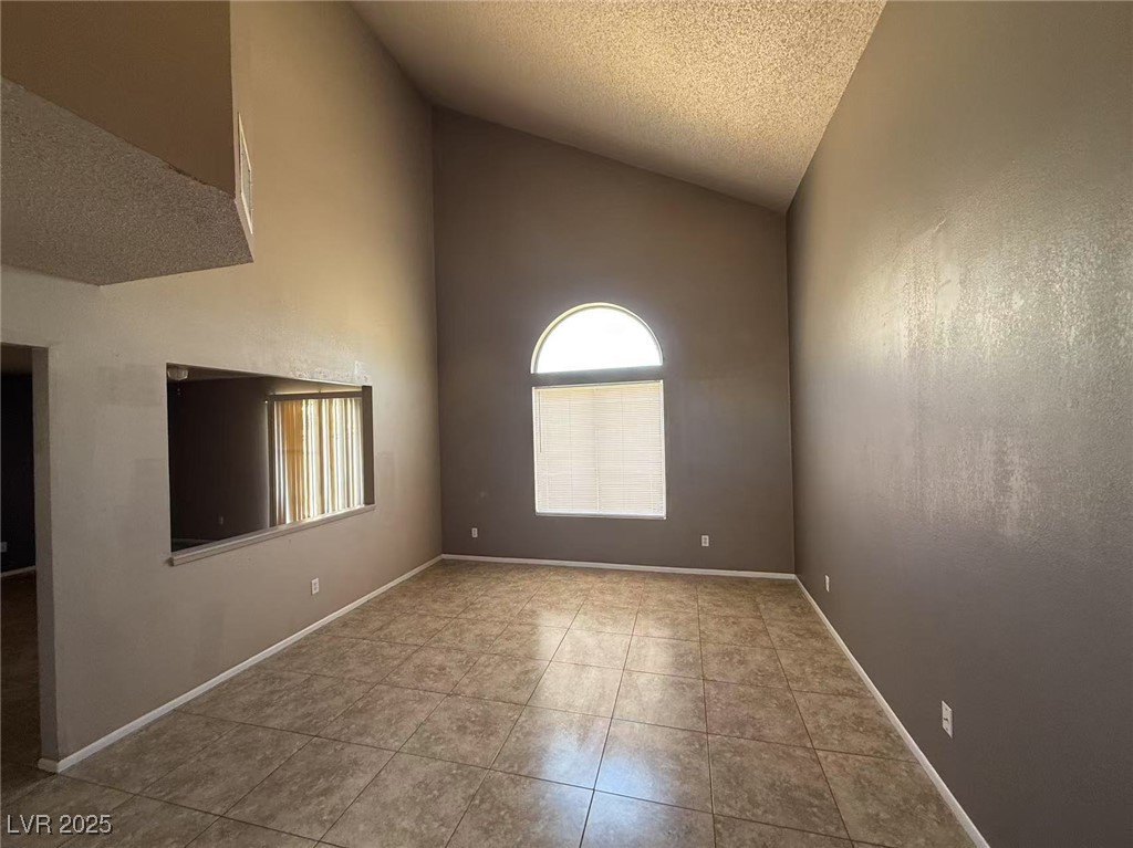 Undisclosed Address Las Vegas, NV 89142 - Photo 14 of 14 Unfurnished room with a textured ceiling, tile pat