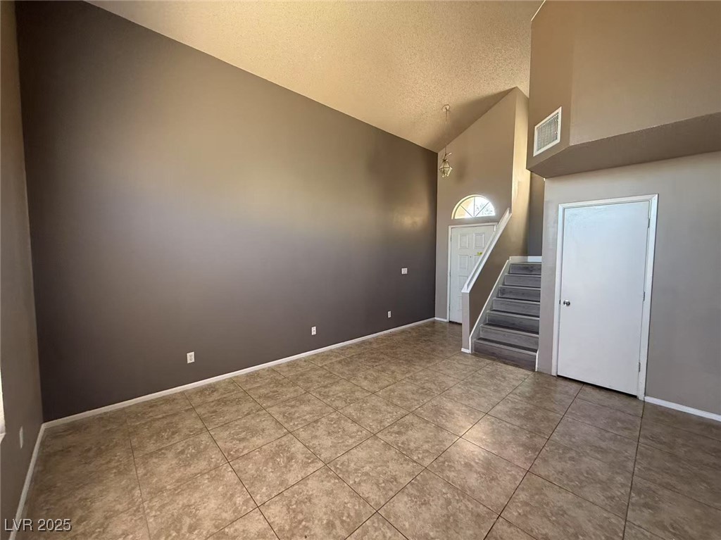 Undisclosed Address Las Vegas, NV 89142 - Photo 2 of 14 Foyer entrance with a textured ceiling, visible ve
