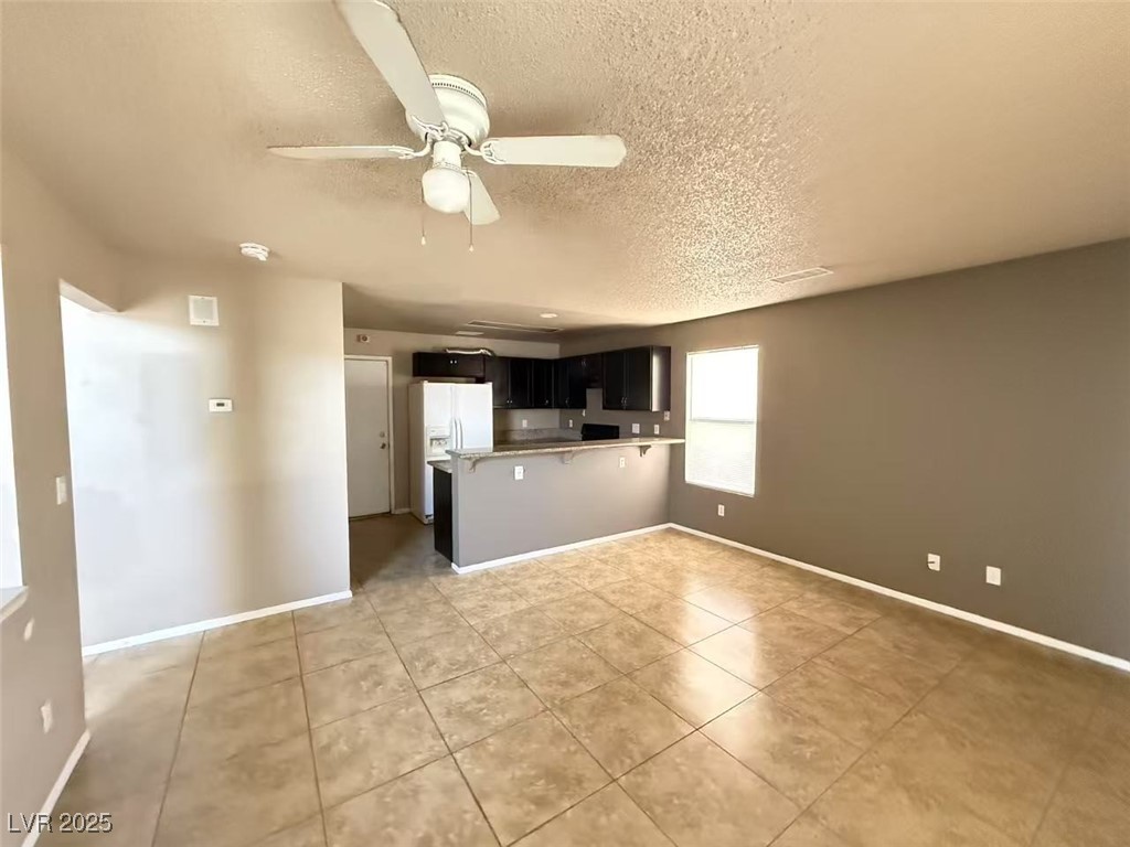 Undisclosed Address Las Vegas, NV 89142 - Photo 5 of 14 Unfurnished living room with baseboards, ceiling f
