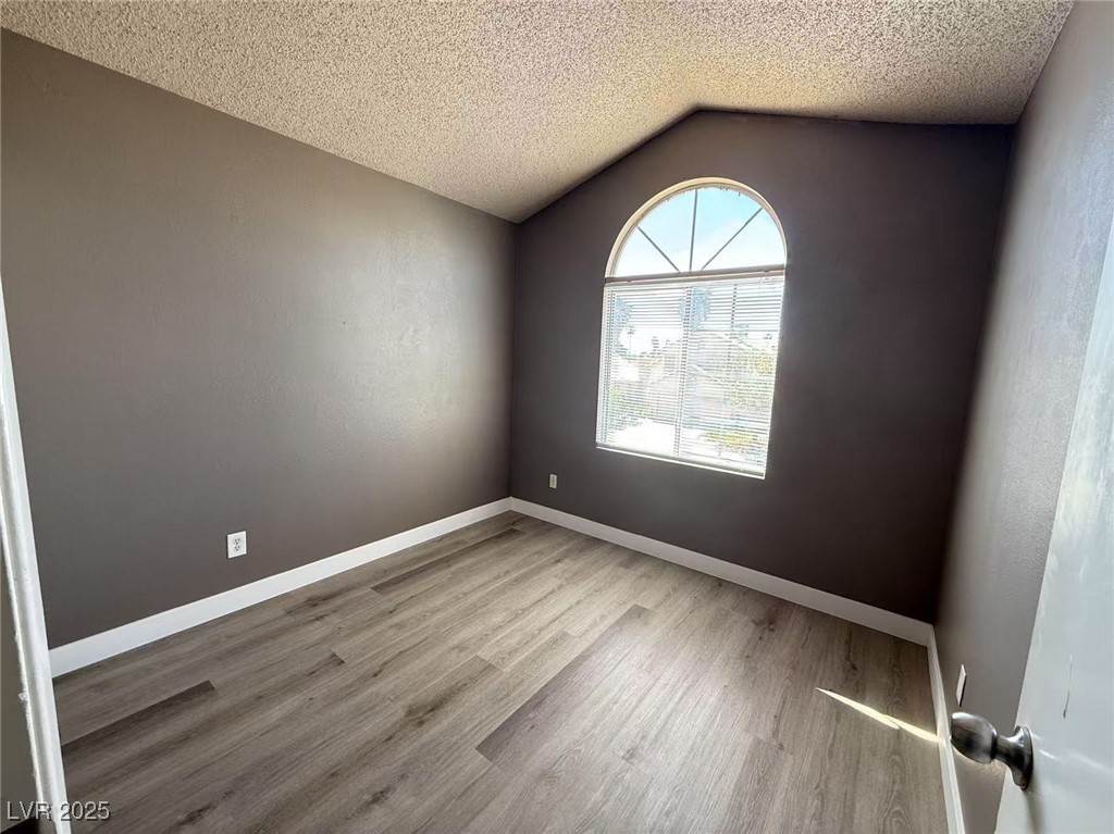 Undisclosed Address Las Vegas, NV 89142 - Photo 7 of 14 Unfurnished room featuring baseboards, a textured