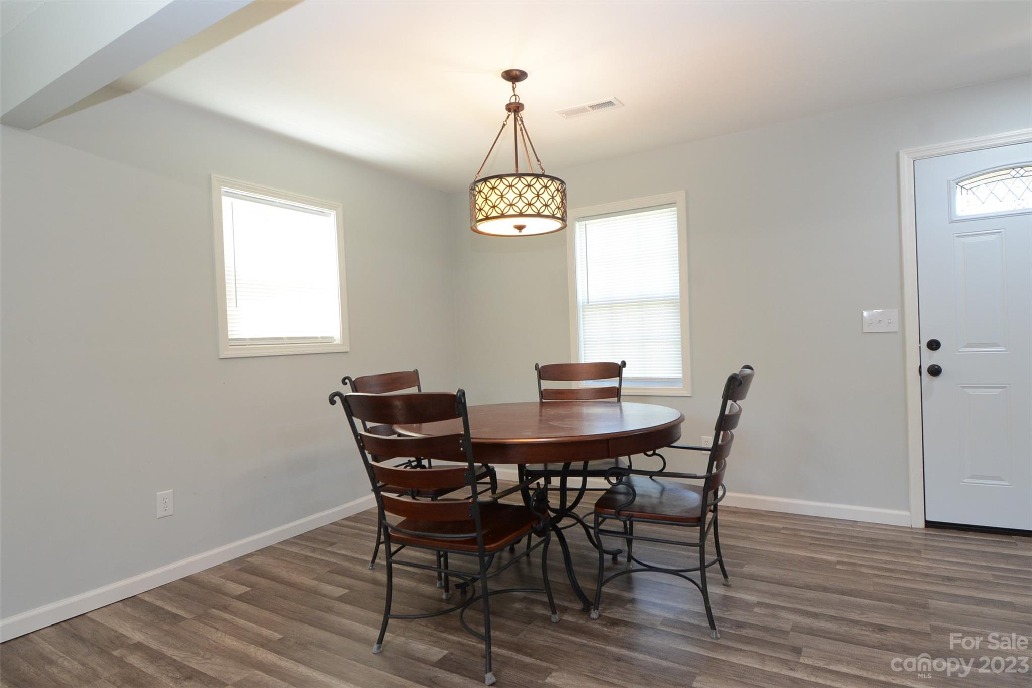336 Church Street Rutherfordton, NC 28139 - Photo 9 of 20 a view of a dining room with furniture window and wooden floor