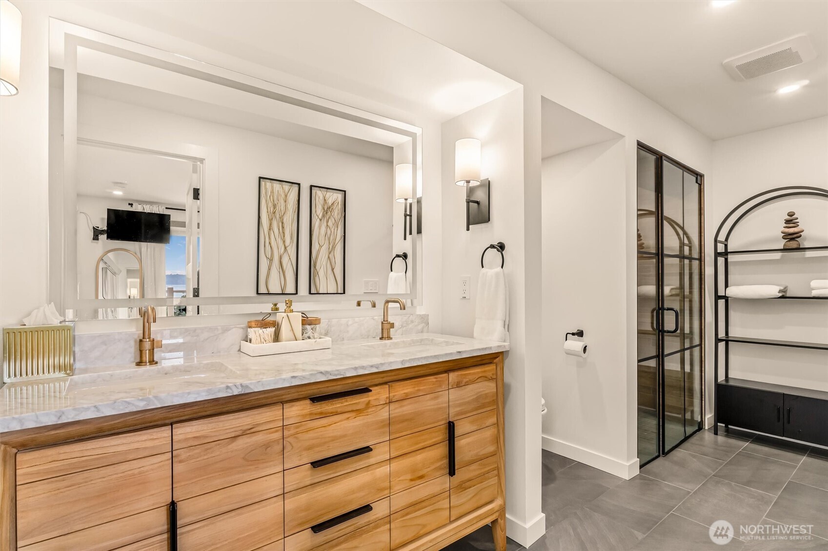 10203 47th Avenue Southwest, Unit D2 Seattle, WA 98146 - Photo 13 of 36 a bathroom with double vanity sink and a mirror
