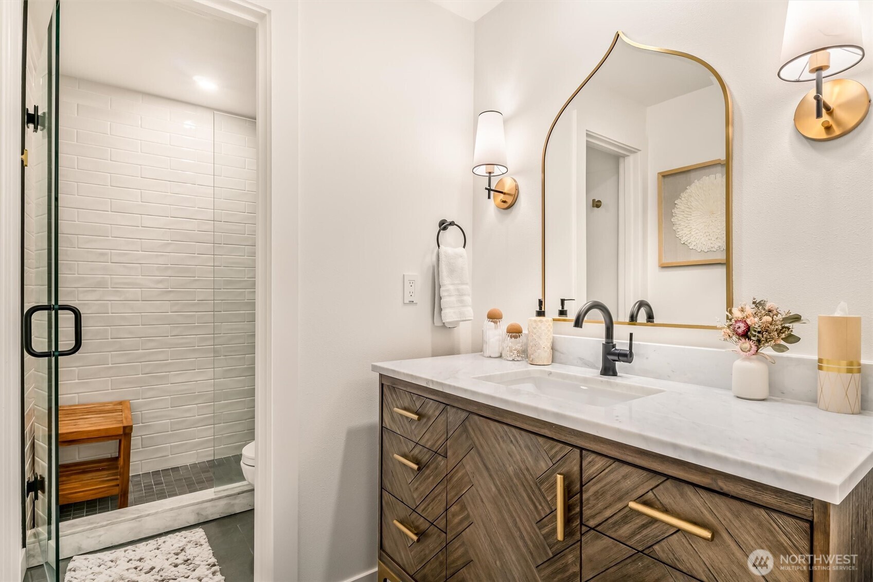 10203 47th Avenue Southwest, Unit D2 Seattle, WA 98146 - Photo 17 of 36 a bathroom with a sink and a mirror