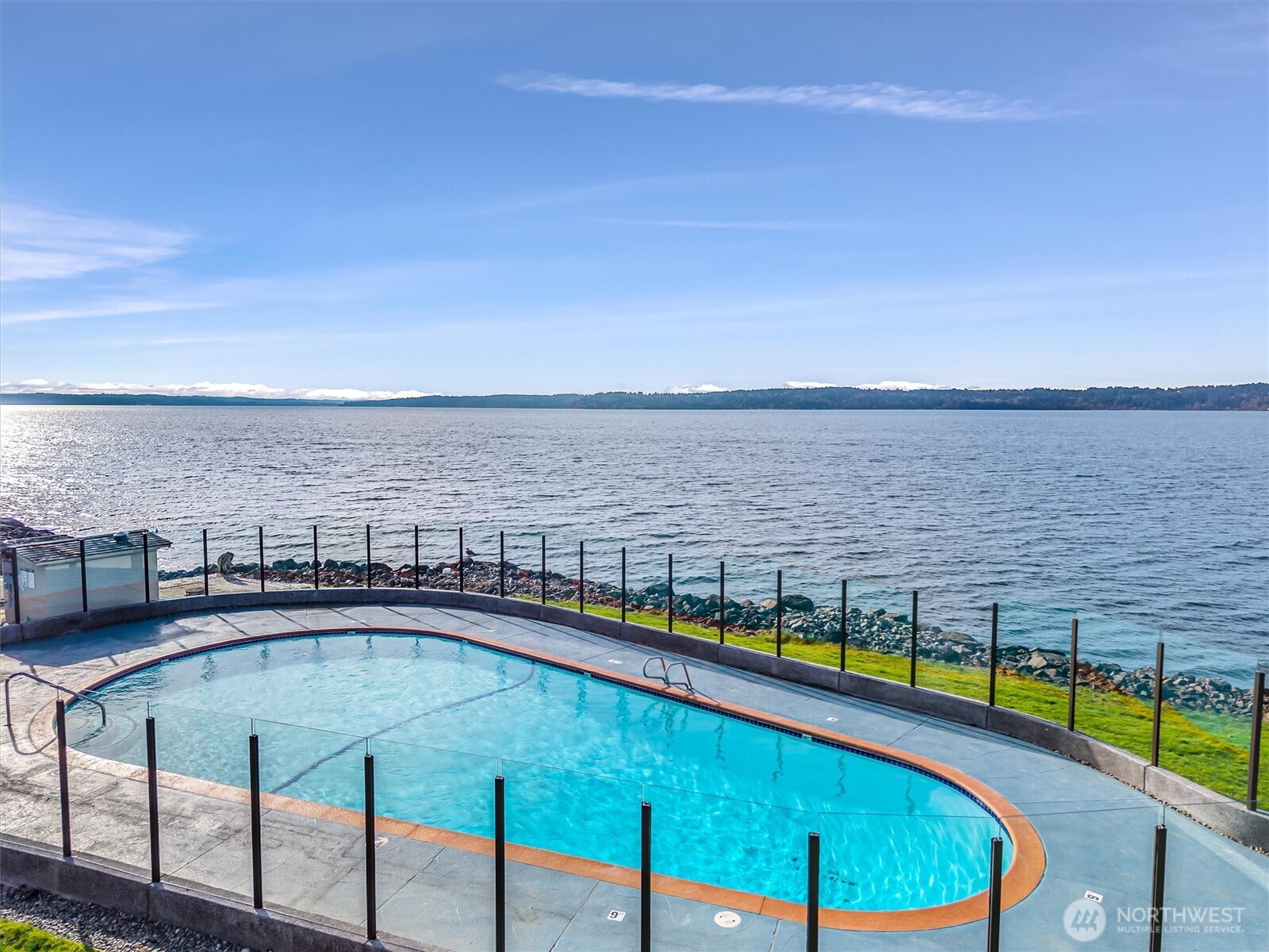 10203 47th Avenue Southwest, Unit D2 Seattle, WA 98146 - Photo 24 of 36 a view of a swimming pool with outdoor seating and yard in the back