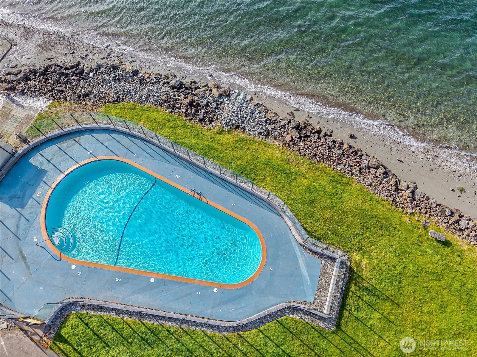 10203 47th Avenue Southwest, Unit D2 Seattle, WA 98146 - Photo 26 of 36 a view of swimming pool from a outdoor seating