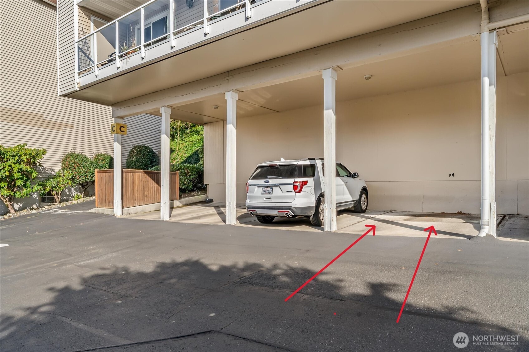 10203 47th Avenue Southwest, Unit D2 Seattle, WA 98146 - Photo 32 of 36 a view of a car park in front of house