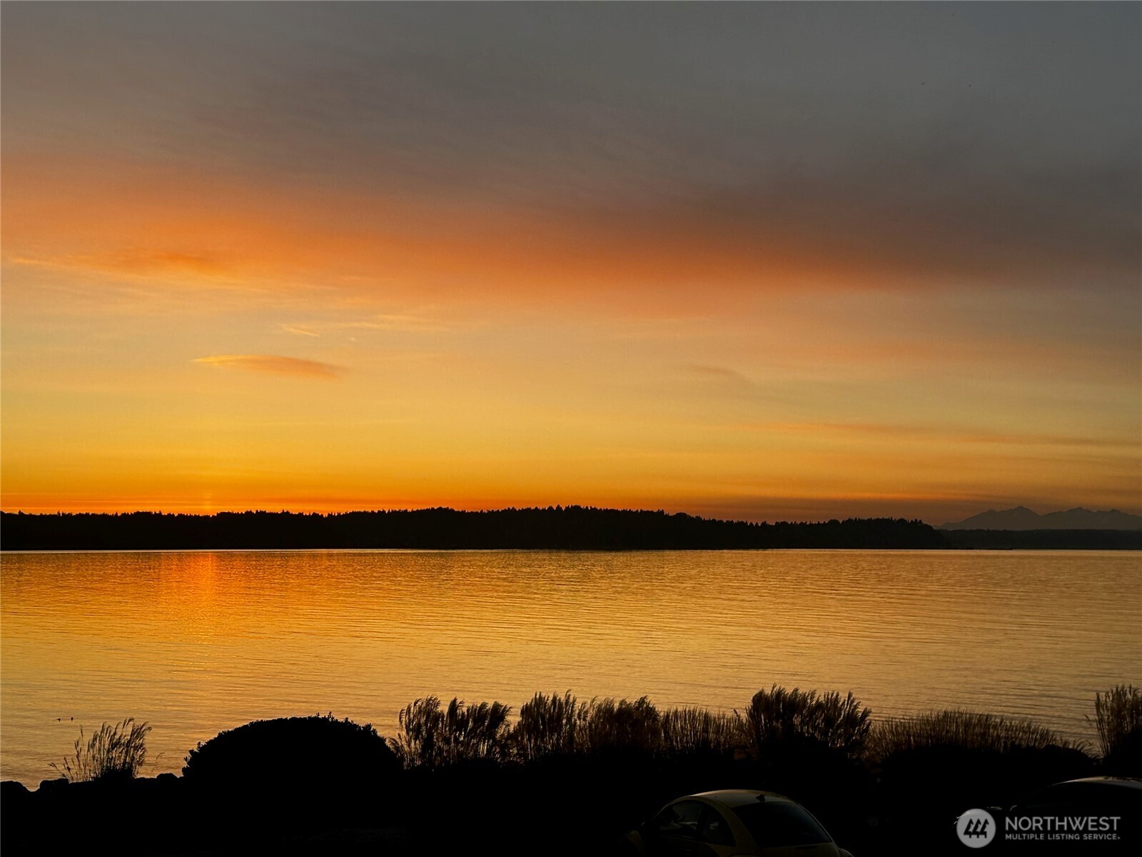 10203 47th Avenue Southwest, Unit D2 Seattle, WA 98146 - Photo 36 of 36 a view of ocean with sunset