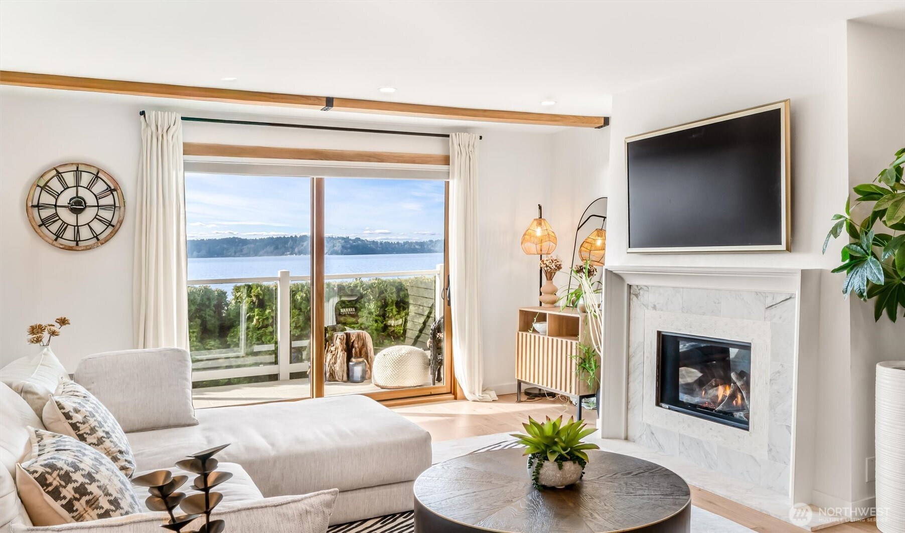 10203 47th Avenue Southwest, Unit D2 Seattle, WA 98146 - Photo 5 of 36 a living room with furniture a fireplace and a flat screen tv