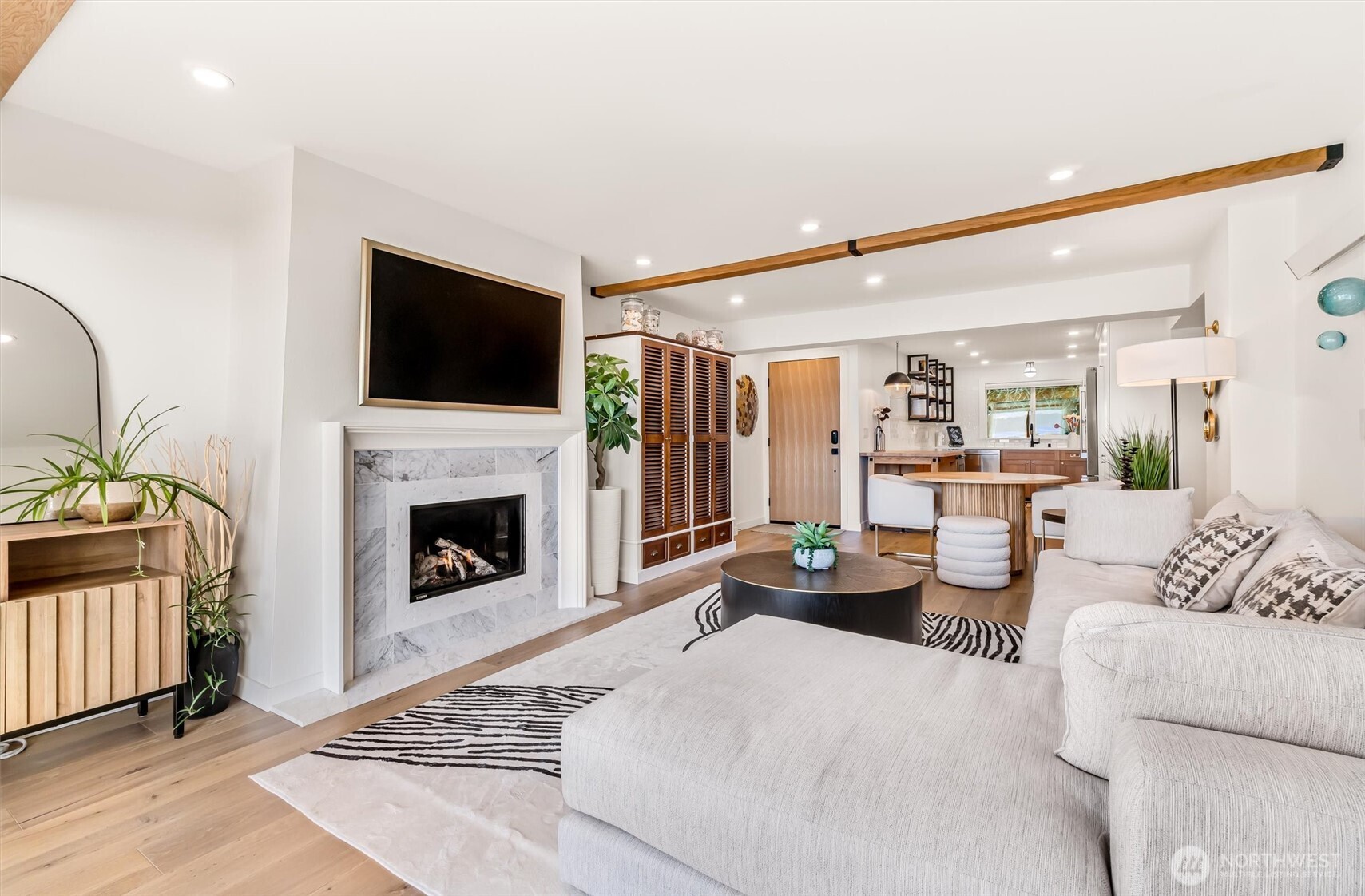 10203 47th Avenue Southwest, Unit D2 Seattle, WA 98146 - Photo 6 of 36 a living room with furniture a fireplace and a flat screen tv