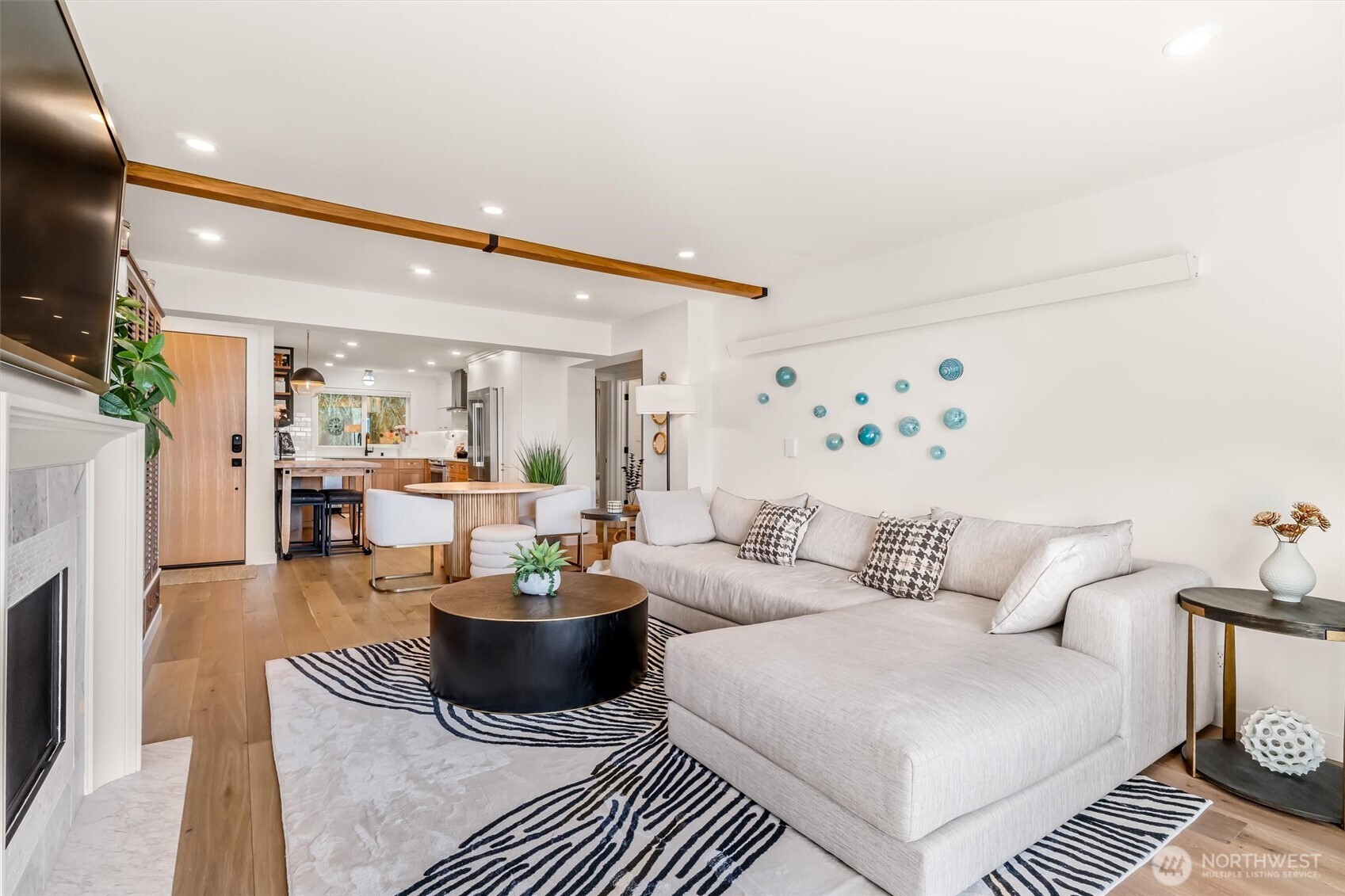 10203 47th Avenue Southwest, Unit D2 Seattle, WA 98146 - Photo 7 of 36 a living room with furniture and a fireplace