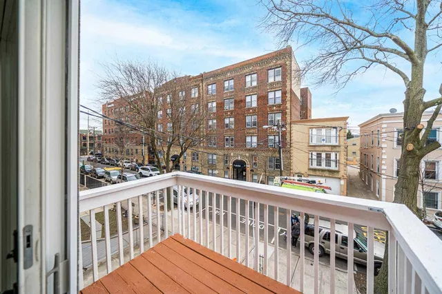 a view of a large buildings from a balcony
