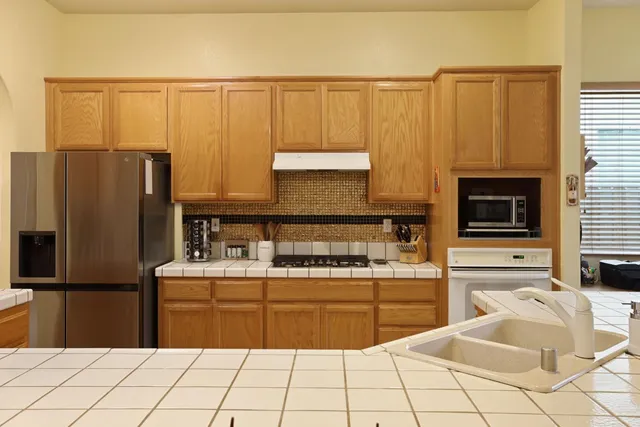 a work room with furniture and a chandelier