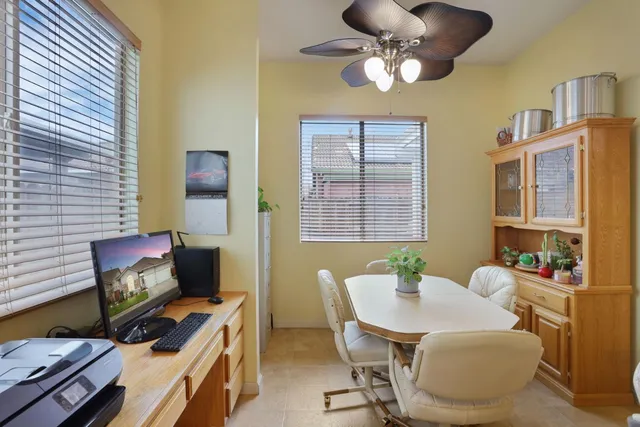 a living room with furniture kitchen and a chandelier