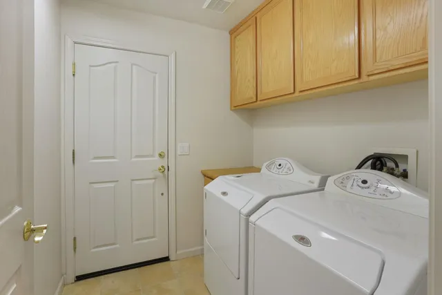 a view of a workspace with furniture and wooden floor