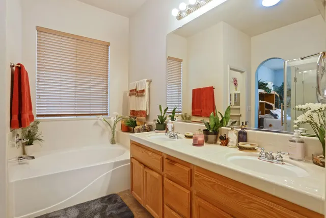 a view of walk in closet with clothes